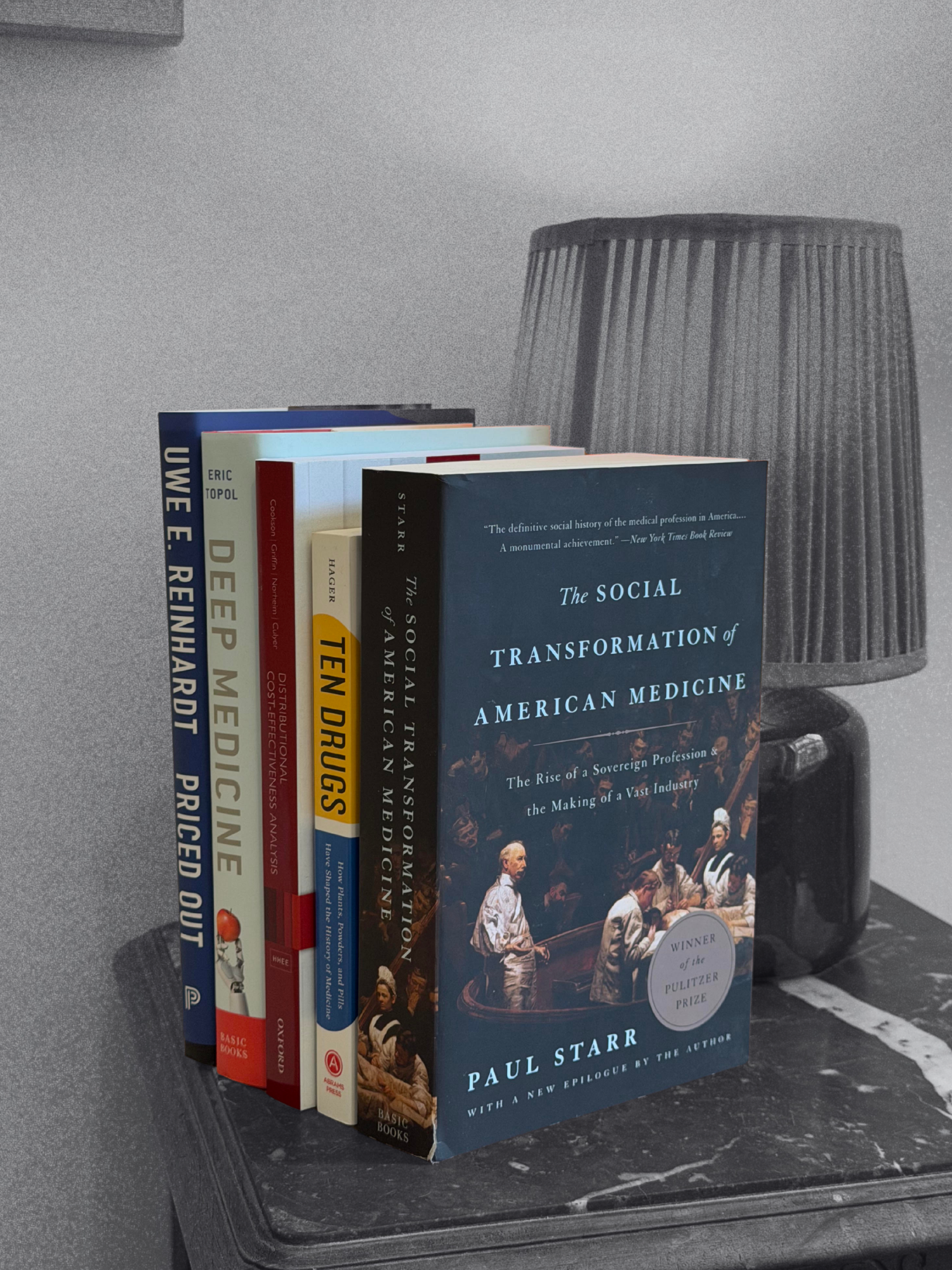 A stack of books bought for future review, including Paul Starr's The Social Transformation of American Medicine